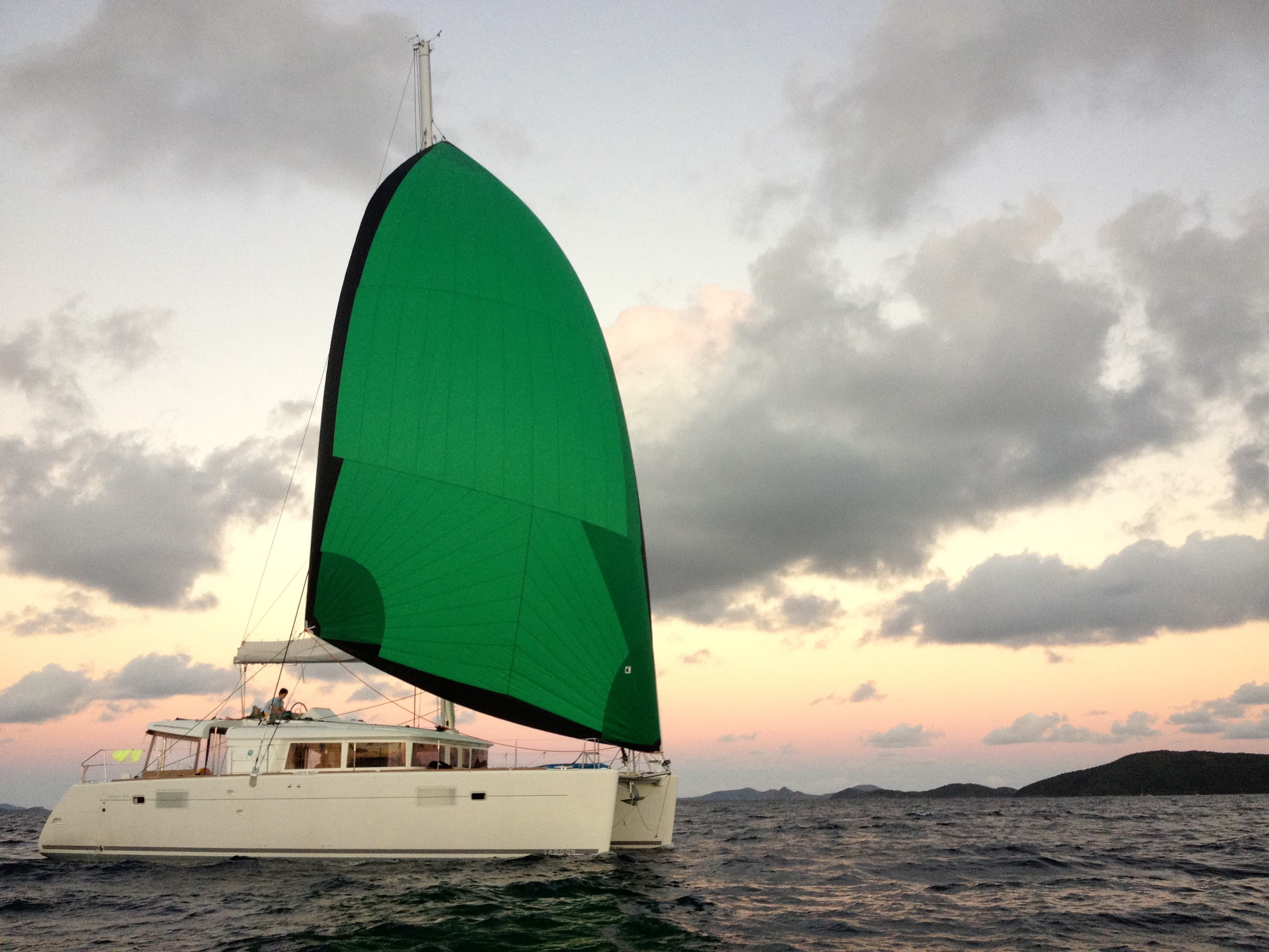 Ad Astra sailing under gennaker at sunset