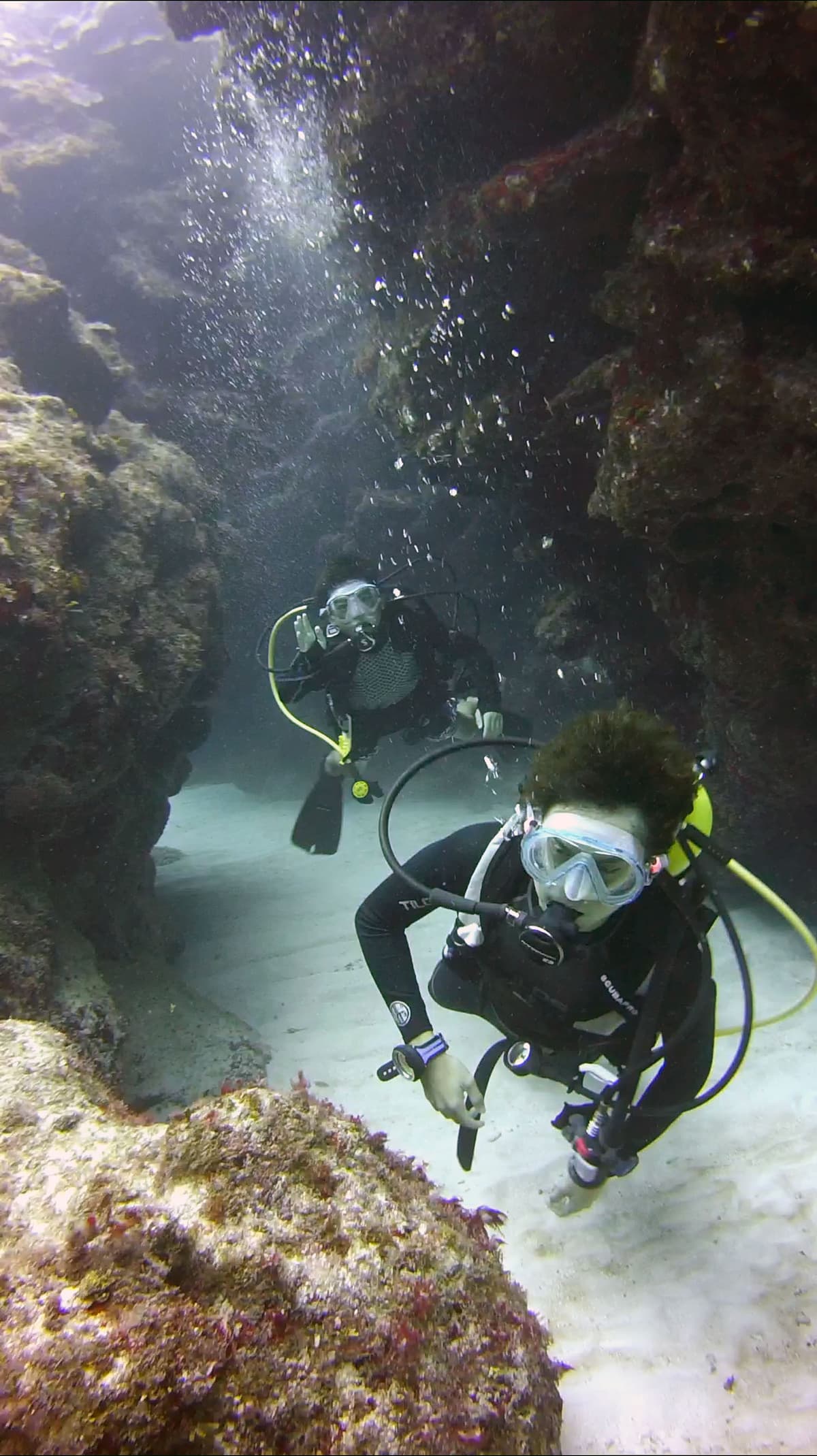 Divers in underwater cave