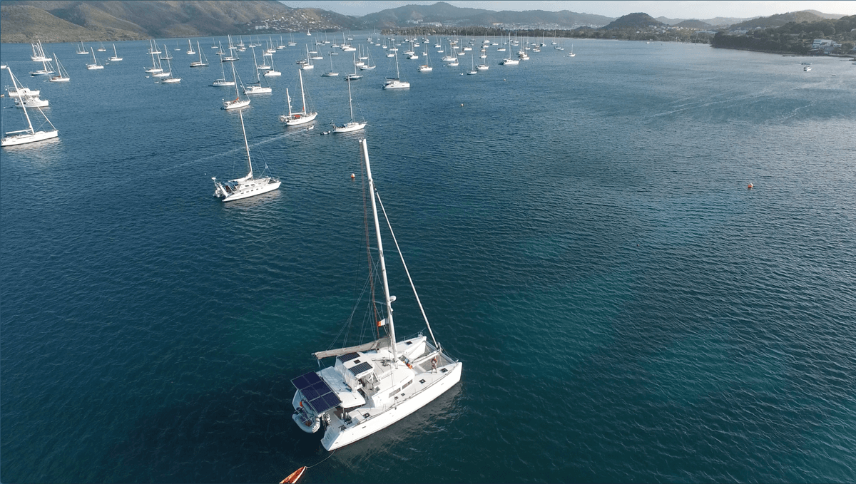 Ad Astra anchored in turquoise Caribbean harbor